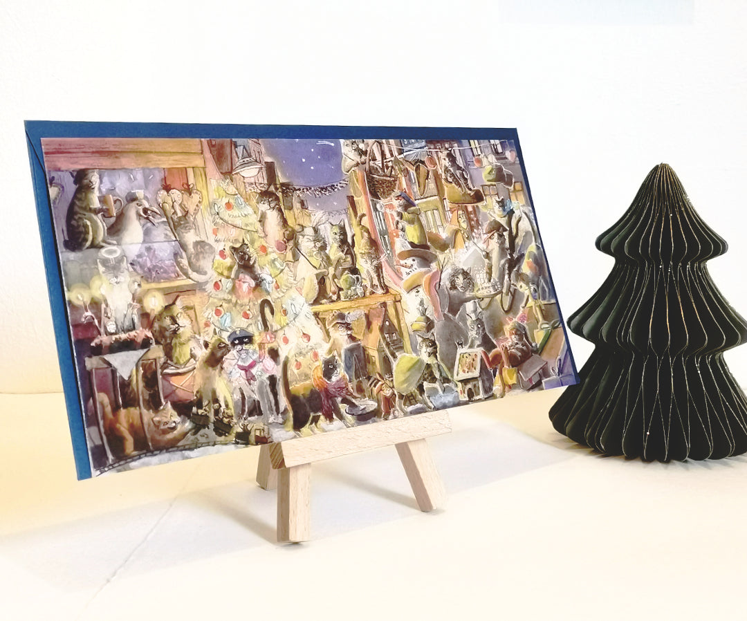 Weihnachtskarte mit ganz vielen Katzen. Es sind die Streetart Katzen aus der Norderstraße Flensburg als Aquarell Illustration und warmen Farben gestaltet. Jede Katze macht etwas anderes weihnachtliches. Kekse backen, Lebkuchenhaus bauen, Sternschnuppen sieht man, Ein Katze mit Schneeball, eine Punschbude. Individuelle Karten und ein gutes Geschenk.